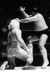 Wahoo hammers a nail into Ric's conk, for security.