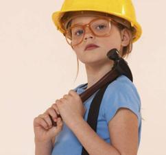 Girl wearing hardhat with hammer