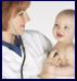 Pediatrician examines infant