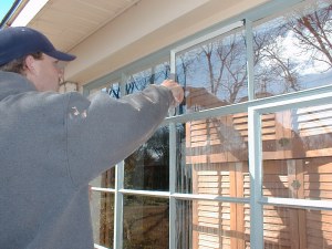 Tim installs glazing putty the old fashioned way which is pretty much a lost art these days.  This type of putty will last several decades longer than the caulking that glaziers typically use these days.

