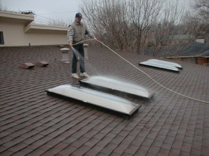 Tim uses lots of water to flush away contaminants from delicate skylight surface both before and after acetic wash.