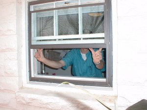 Tim reinstalls the storm window sashes and screen after thoroughly cleaning and detailing them along with the primary window unit.