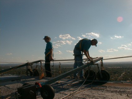 Kevin and Tim continue rigging 300 feet above the city of Abilene, Texas as the sun prepares to call it a day.