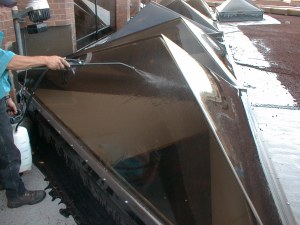 After carefully cleaning the skylights, Shaun finishes the job with a beautiful spot free rinse.